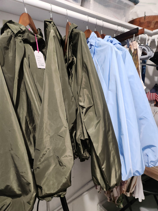 Againt the Italian windbreaker.  Blue or forrest green